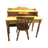 A pine desk with shaped back and shelf above a small drawer, the rectangular rounded top above a