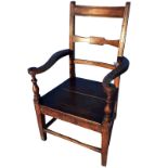 A mixed wood nineteenth century bar-back country elbow chair with ribbed decoration and scrolled