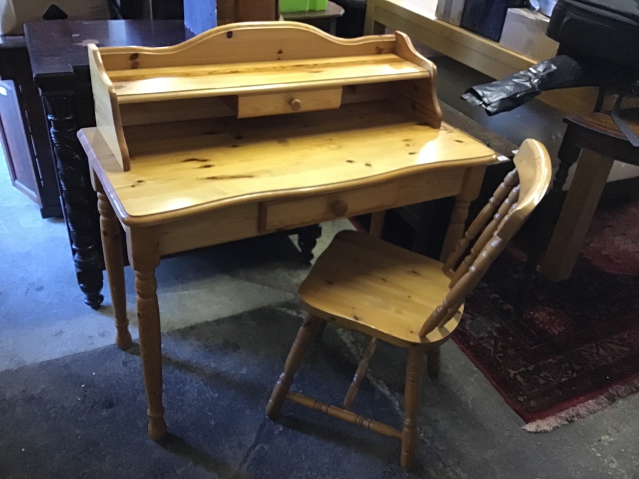 A pine desk with shaped back and shelf above a small drawer, the rectangular rounded top above a - Image 2 of 3