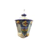 A ceramic hall lantern suspended by chain with majolica floral glazed tapering octagonal enclosure