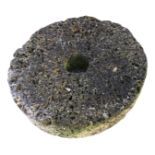 A 2ft millstone wheel - by repute from Berwick Barracks for grinding gunpowder/charcoal. (24in)