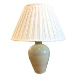 A large Denby stoneware vase tablelamp with floral decoration, mounted with pleated fabric shade. (