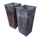 A pair of zinc lead-style garden urns, the square tapering tubs with weighted bases, having