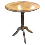 A circular occasional table with moulded top on turned column with quadripartite shaped legs. (19.