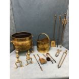 A set of three brass fire irons with ribbed handles - poker, tongs & shovel; a pair of brass and