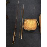 An Alex Martin split cane two piece rod with cloth sleeve; a cane fishermans creel with canvas