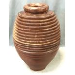 A large ovoid ribbed vase with ring-turned rim, the turned hardwood pot in two halves. (20.5in)