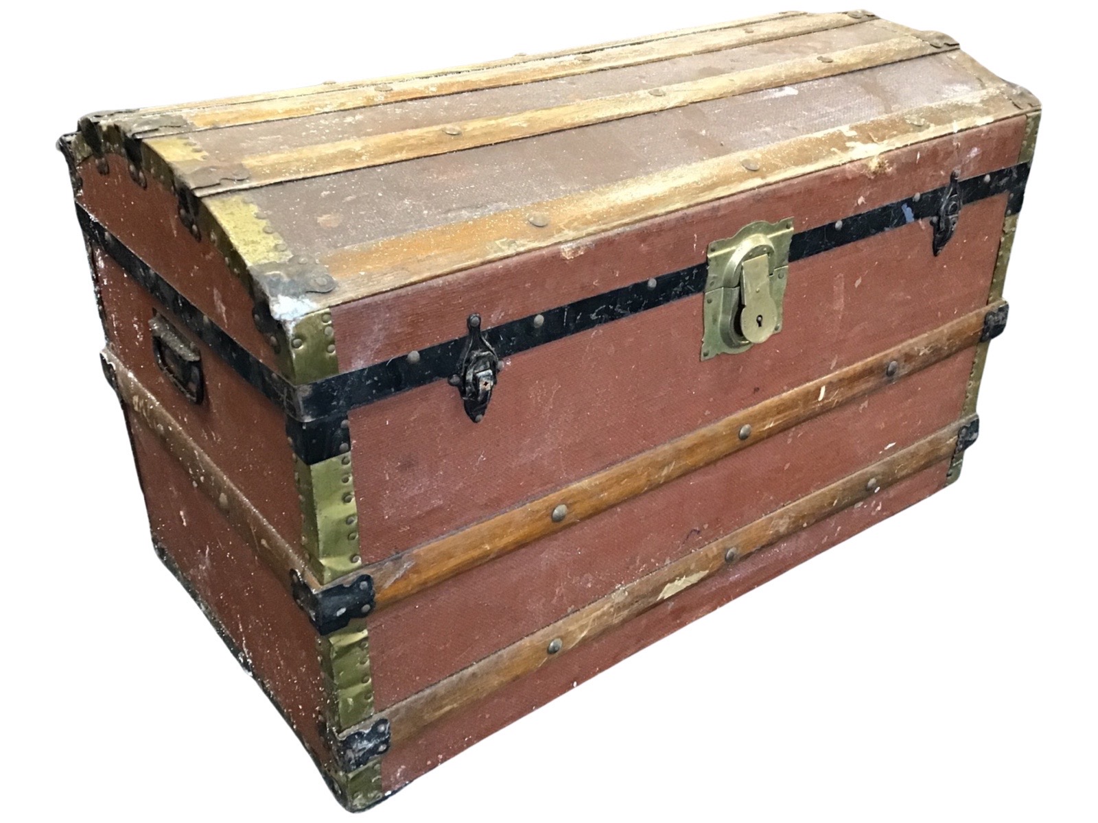 A dome top cabin trunk with studded pine batons, iron and brass mounts with brass lock. (33in x 18.