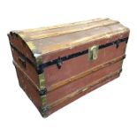 A dome top cabin trunk with studded pine batons, iron and brass mounts with brass lock. (33in x 18.