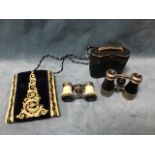 A pair of French opera glasses in contemporary pouch with gilt thread embroidered decoration; and