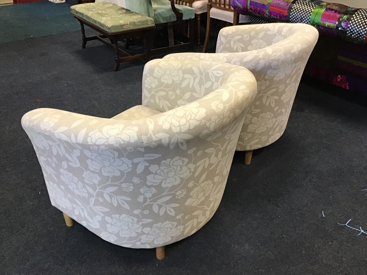 A pair of contemporary tub armchairs of horseshoe shape with loose cushions, raised on turned - Image 3 of 3