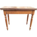 A mahogany turn-over-top tea table on an associated ash base (wormed), the rectangular flip top