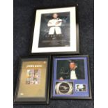 Three framed James Bond related prints - one signed by Daniel Craig. (3)