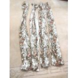 A suite of four printed curtains with floral spays on pale cream ground. (86.5in) (4)