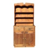 A rectangular pine dresser, the associated delft rack with shaped apron and sides, having tongue &