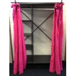 A metal bedroom clothes store with hanging compartment and four shelves enclosed by lined cotton