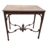 An Adams style Edwardian mahogany centre table, the rectangular top with leaf carved edge above a