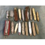 A collection of pen knives - Swiss, wood & brass handled, smokers knives, advertising knives, one