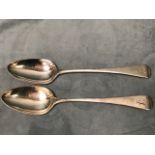 A pair of Georgian silver table spoons with pointed bowls and engraved handles - London, Stephen