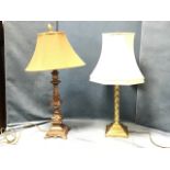 A brass tablelamp with twisted column on square moulded plinth, mounted with octagonal fabric shade;