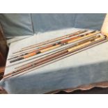 A 13ft three-piece fibreglass salmon fly rod; two old split cane rods with brass mounts; and a