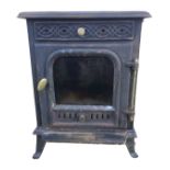 A Country Kiln cast iron woodburning stove with rectangular moulded top above a fretwork air vent