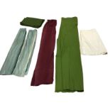A pair of lined green velvet curtains; a long lined maroon brocade door curtain; a green baize cloth