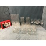A set of tall wine glasses with tulip shaped bowls; a boxed set of four Italian wine glasses; a