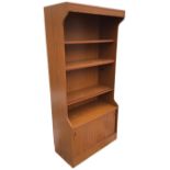 A Schreiber walnut effect dresser, with overhanging illuminated cornice above open shelves, the base