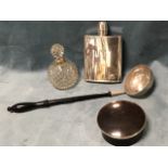 A nineteenth century ebonised toddy ladle set with a George III coin to circular bowl; a circular