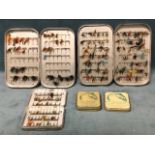 Three Wheatley aluminium fly boxes containing a quantity of fishing flies - salmon, seatrout and