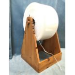 A salmon wrapper on triangular pine stand, with roll of thick polythene bags on roller. (22.5in)