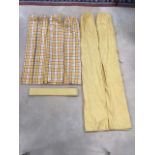 A pair of lined and interlined yellow cotton curtains printed with small dot flowerheads, with panel