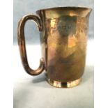 A hallmarked silver tankard with flaired foot having C-shaped handle - Birmingham, 1942, 150g. (3.