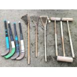 Three lacrosse sticks with leather thong baskets; four miscellaneous hockey sticks; and three