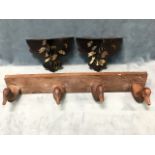 A pair of Victorian papié maché wall shelves with D-shaped platforms above supports decorated with