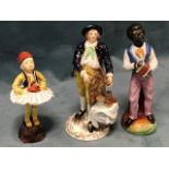 A nineteenth century Derby porcelain figure of a gentleman standing beside his basket of victuals,
