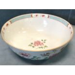 A large nineteenth century Chinese porcelain famile rose bowl on tubular foot, decorated with garden
