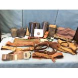 Miscellaneous Sam Brown military belts, a canvas game bag, leather belts, an antique copper powder