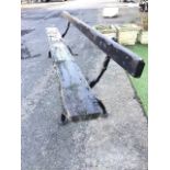 A 9ft Victorian rectangular garden bench with plank seat and back on cast iron log type supports. (