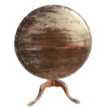 A nineteenth century mahogany snap-top occasional table, with acanthus carved border to circular