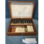 A cased British Drug Houses Ltd testing kit, the box containing 30 glass files of chemicals -