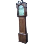 A nineteenth century mahogany longcase clock with pierced fretwork to swan-neck pediment, the arched