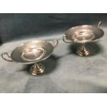 A pair of art nouveau hallmarked silver tazzas, the bowls with moulded rims having tapering