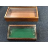 A glazed display case with angled hinged lid, the interior tray with baize lining; and a rectangular