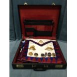 A case of masonic gear including eleven leather aprons, badges, pendants, etc. (A lot)