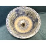 A Victorian Staffordshire blue & white washbowl with flat rim, transfer printed with bucolic
