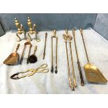 A set of three brass fire irons with ribbed handles - poker, tongs & shovel; a pair of brass