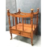 A nineteenth century mahogany canterbury with slatted frame around three divisions with dished