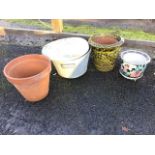 A circular galvanised twin-handled bin & cover; two terracotta garden flowerpots - one with tiger